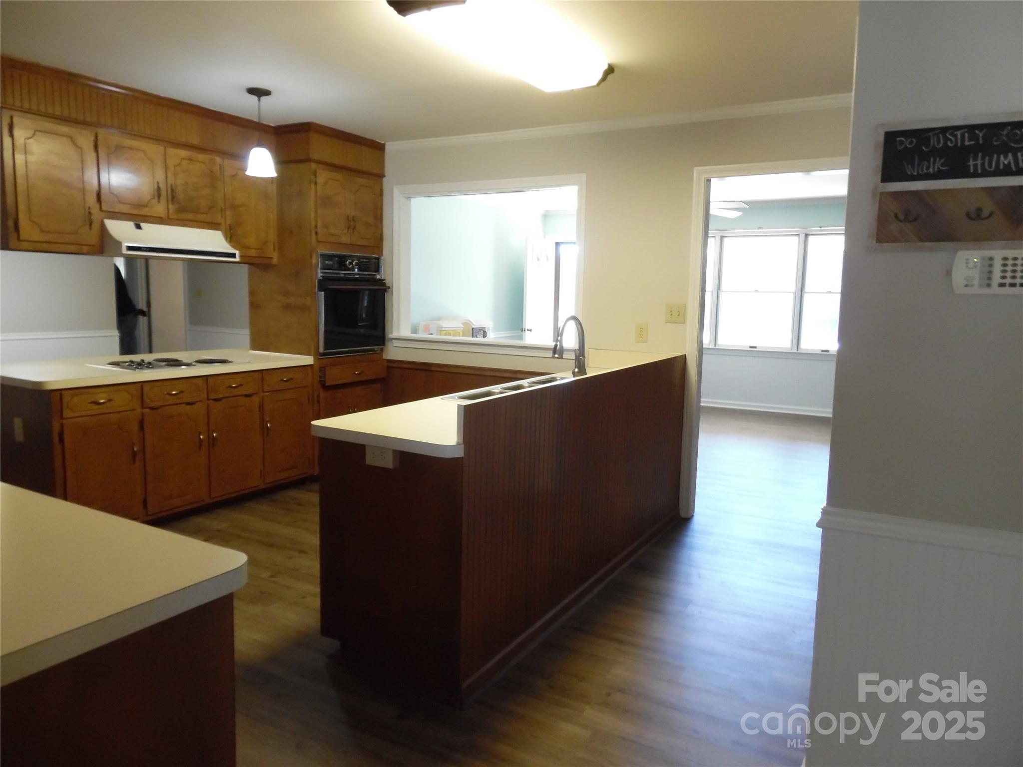 3857 Buffalo Shoals Road Maiden, NC 28650 - Photo 14 of 27 a kitchen with kitchen island granite countertop a sink a counter top space and cabinets