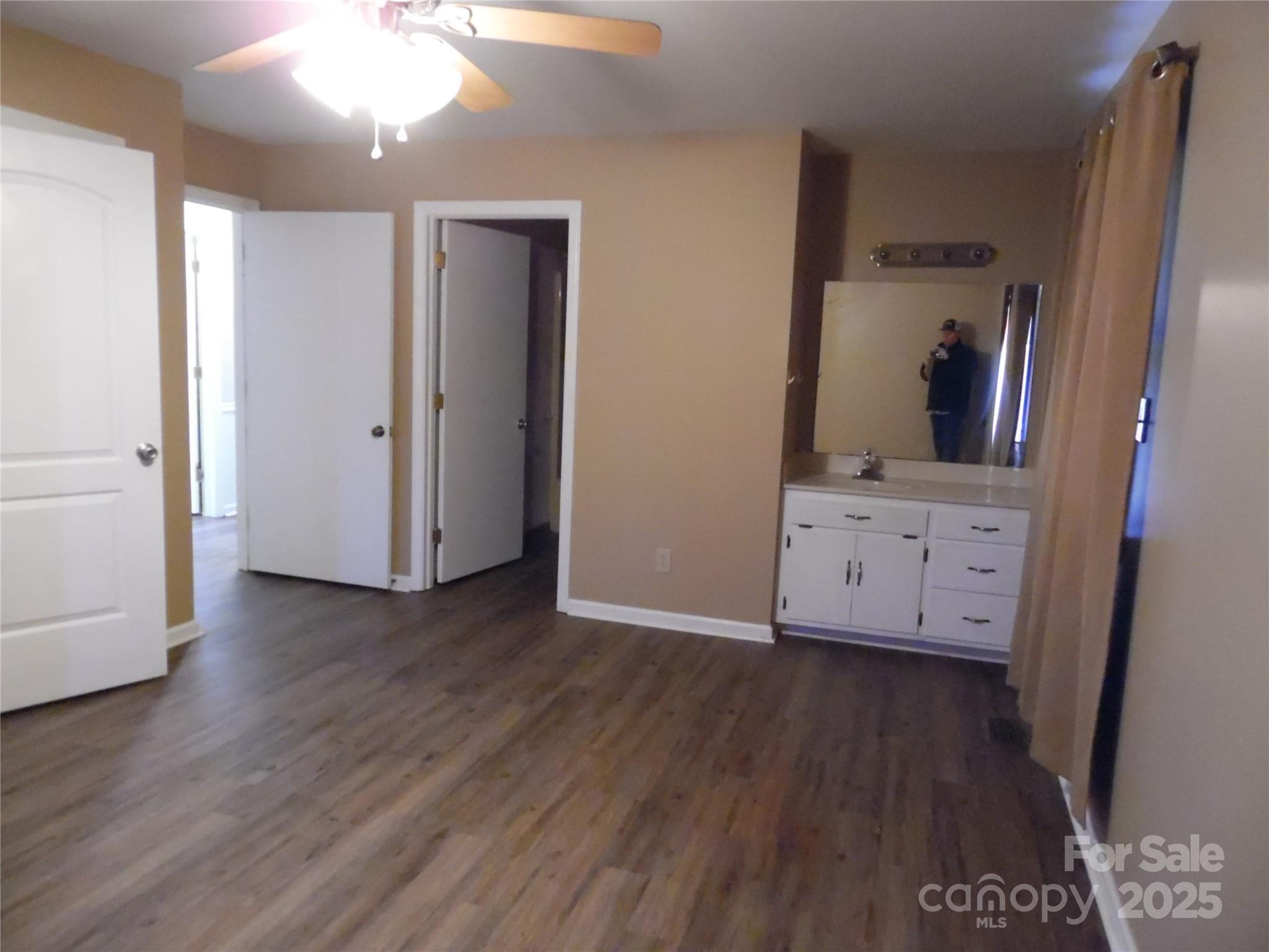 3857 Buffalo Shoals Road Maiden, NC 28650 - Photo 27 of 27 an entryway with wooden floor and cabinet
