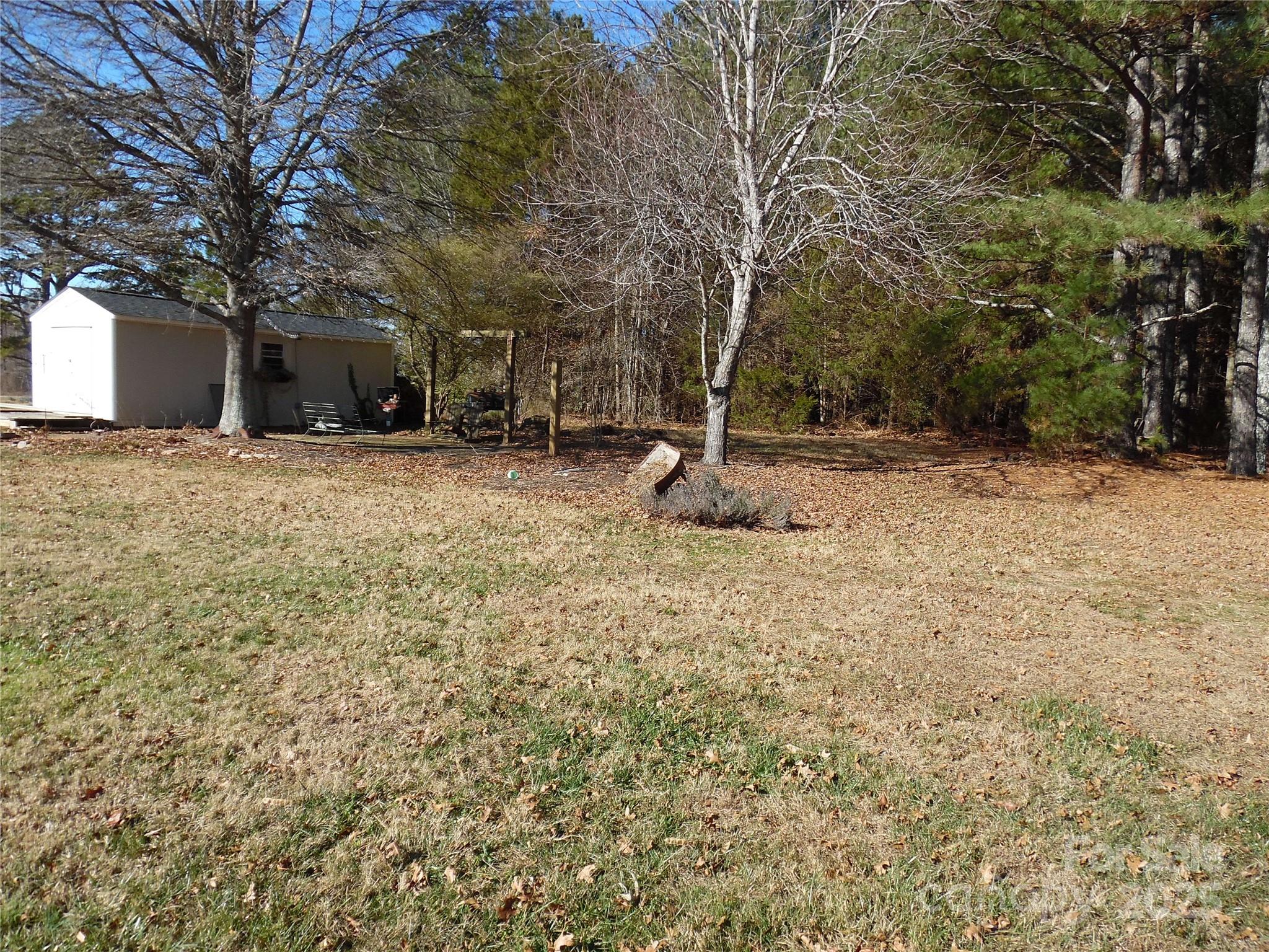 3857 Buffalo Shoals Road Maiden, NC 28650 - Photo 9 of 27 a view of a yard with trees