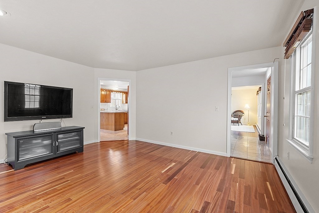 5 Sycamore Drive Rutland, MA 01543 - Photo 21 of 41 a view of a livingroom with wooden floor and a flat screen tv