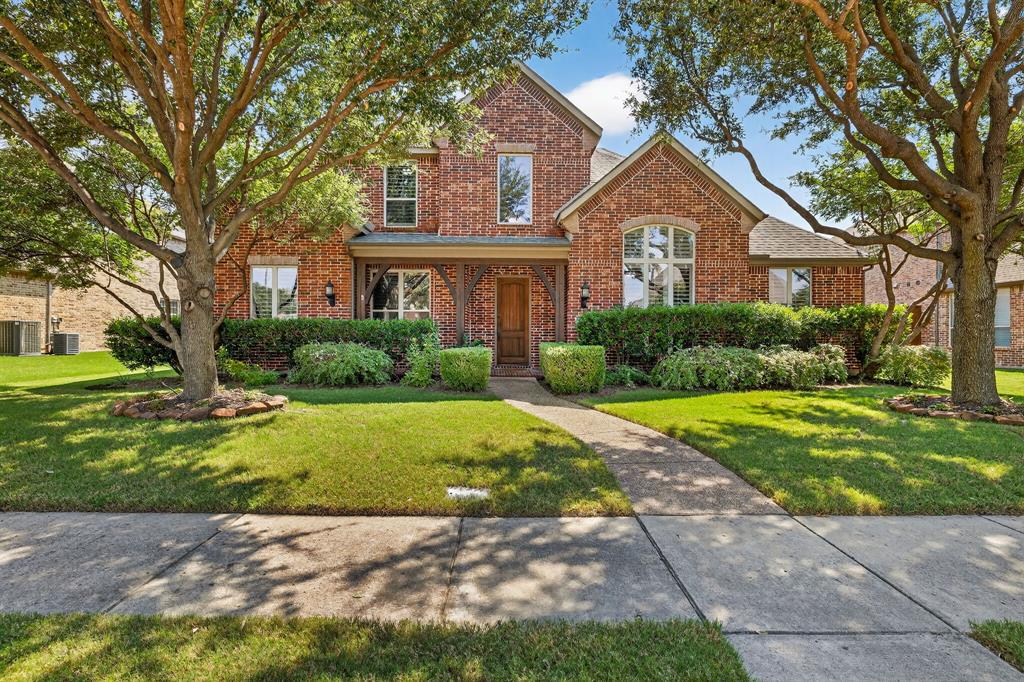 5969 Franklin Court Frisco, TX 75033 - Photo 1 of 1 a front view of a house with garden