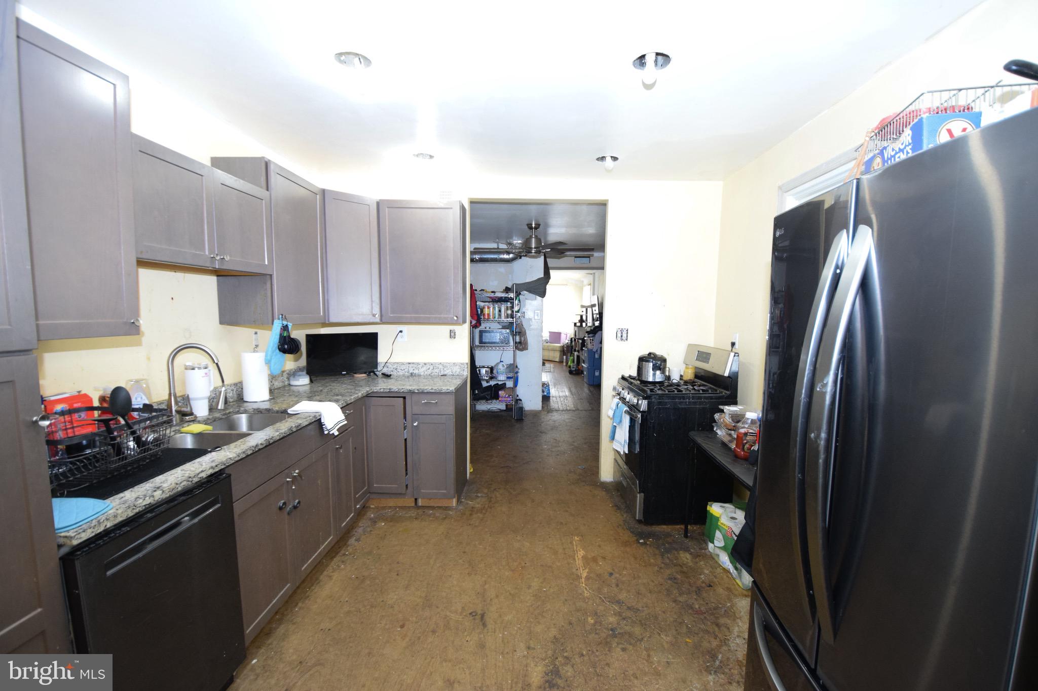 2707 McComas Avenue Baltimore, MD 21222 - Photo 13 of 31 a kitchen with refrigerator and cabinets