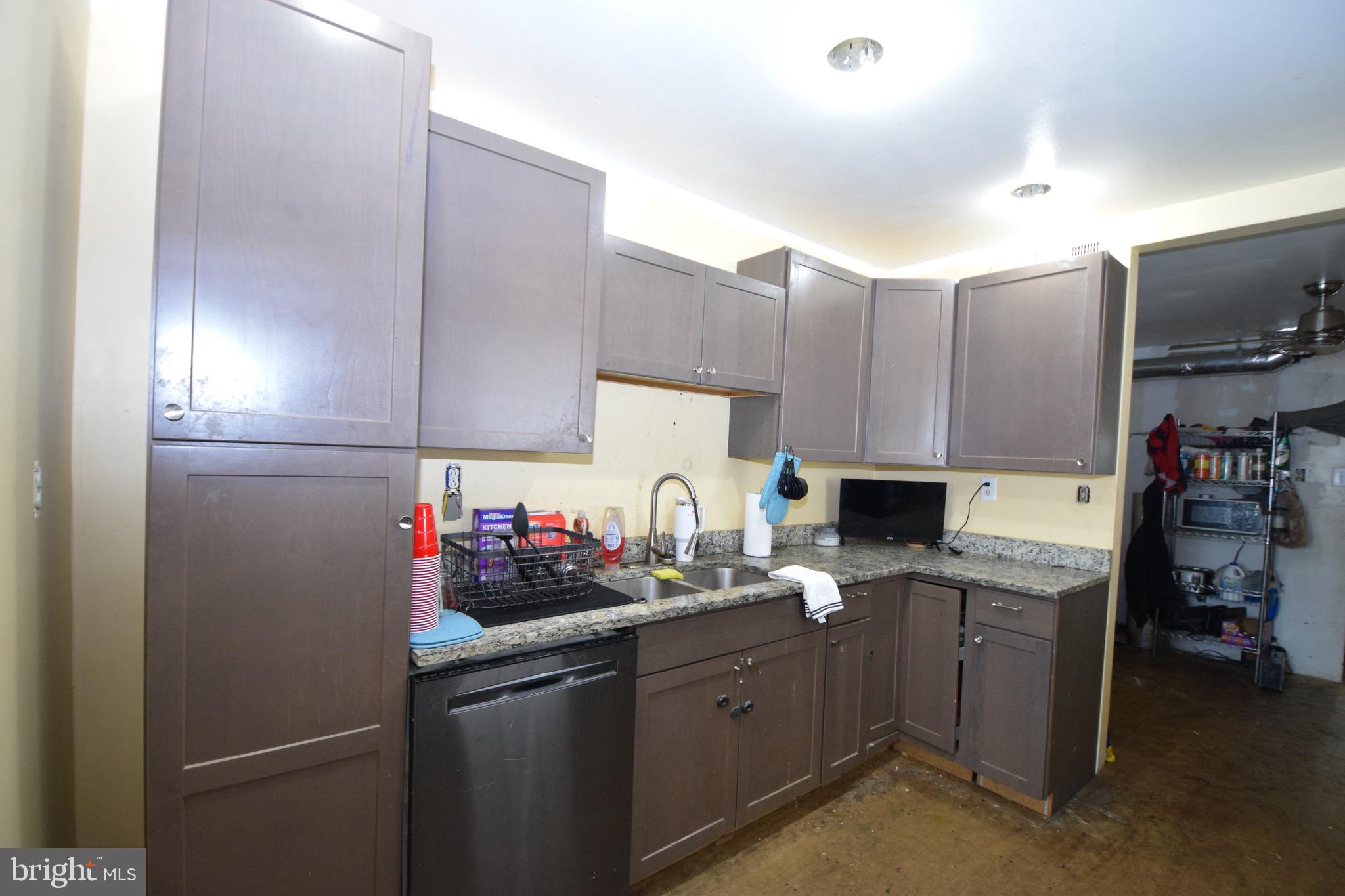 2707 McComas Avenue Baltimore, MD 21222 - Photo 14 of 31 a kitchen with cabinets a sink and appliances