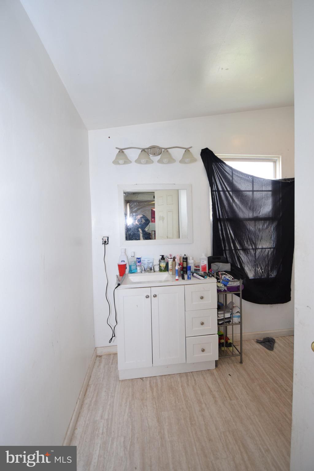 2707 McComas Avenue Baltimore, MD 21222 - Photo 16 of 31 a room with storage and utility