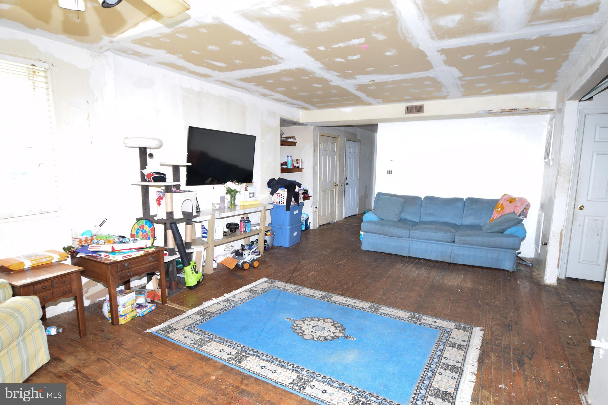2707 McComas Avenue Baltimore, MD 21222 - Photo 2 of 31 a living room with furniture and a flat screen tv