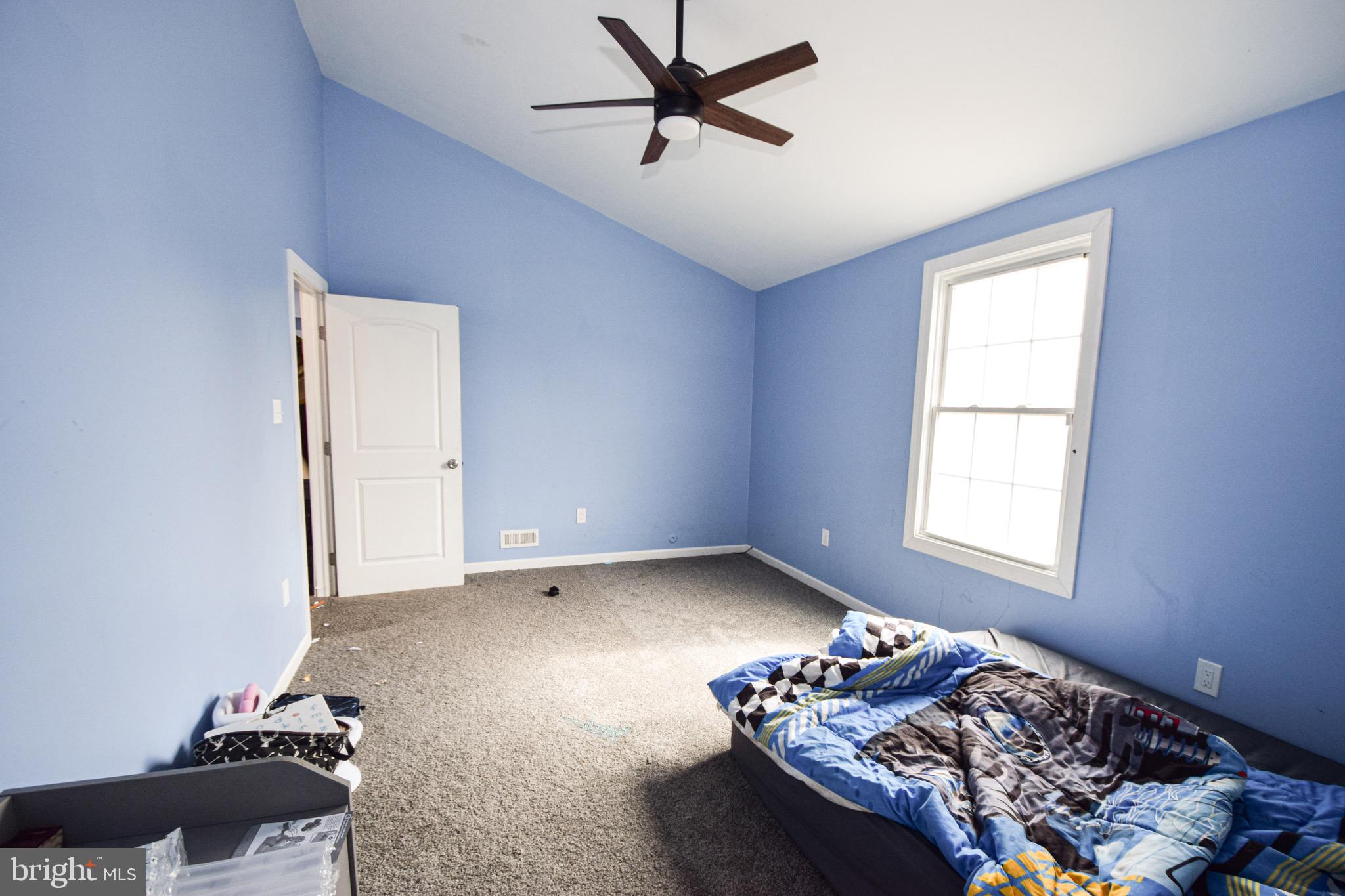 2707 McComas Avenue Baltimore, MD 21222 - Photo 23 of 31 a bedroom with bed and a window