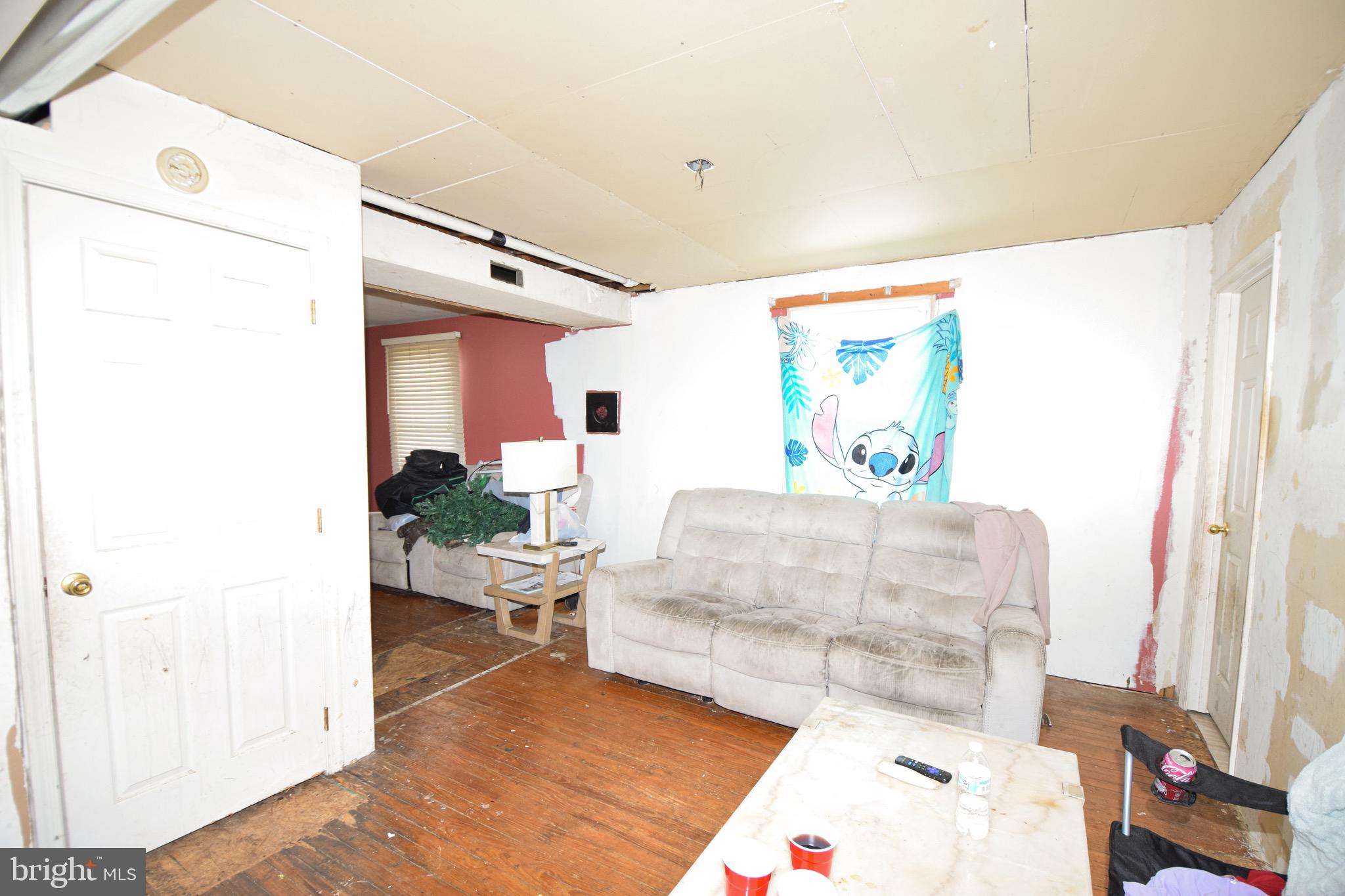 2707 McComas Avenue Baltimore, MD 21222 - Photo 5 of 31 a living room with furniture and a flat screen tv
