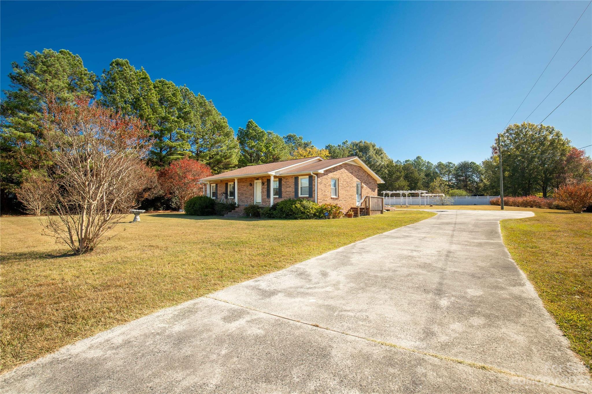 144 State Rd S-46-422 Clover, SC 29710 - Photo 18 of 23 a view of house with outdoor space and swimming pool