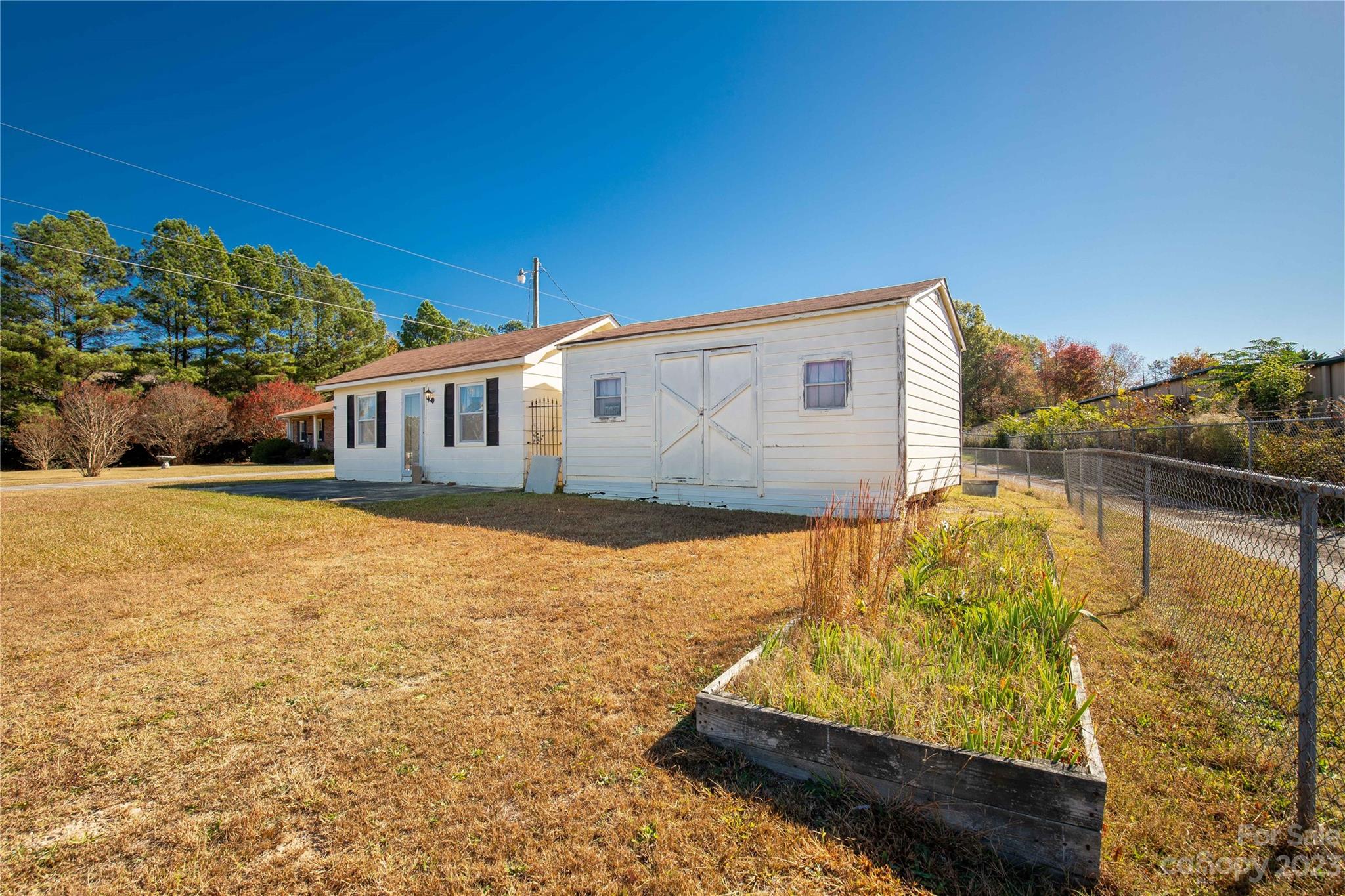 144 State Rd S-46-422 Clover, SC 29710 - Photo 19 of 23 a view of a house with a yard