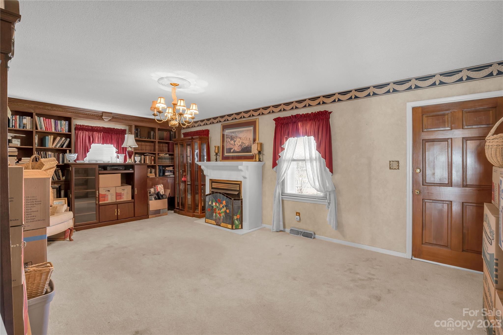 144 State Rd S-46-422 Clover, SC 29710 - Photo 7 of 23 a view of a livingroom with a fireplace and a window