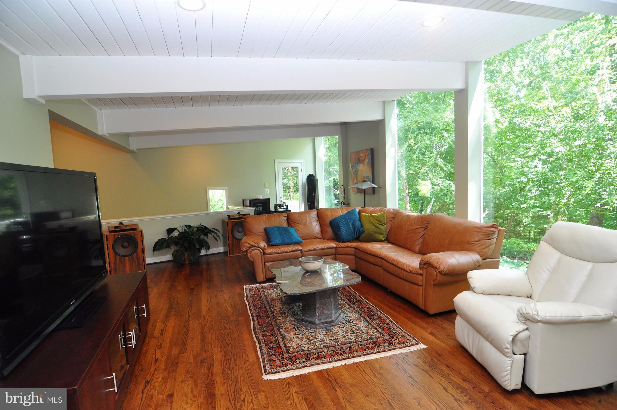 947 Swinks Mill Road McLean, VA 22102 - Photo 6 of 30 Family Room floor to ceiling windows on to court y