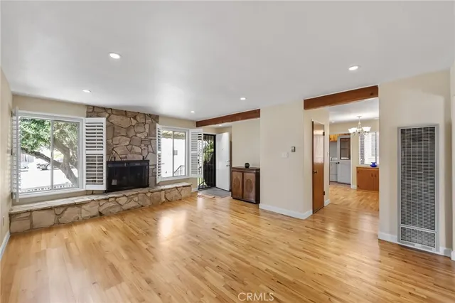 a kitchen with kitchen island granite countertop a sink cabinets and stainless steel appliances