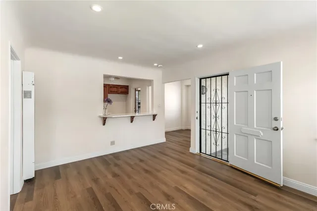 a view of a kitchen with wooden floor