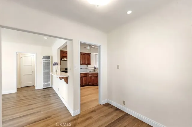 a kitchen with stainless steel appliances a sink stove and cabinets