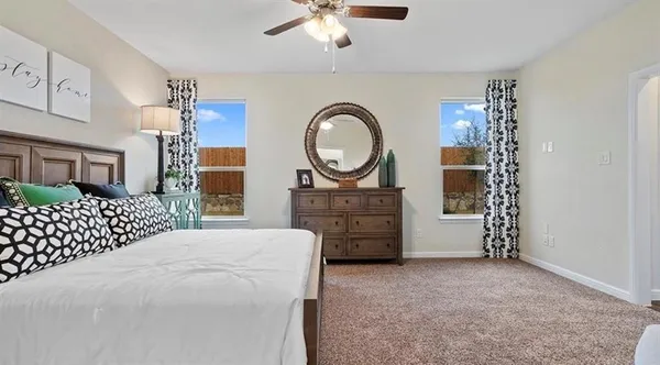 a room with a baby bed and a dresser