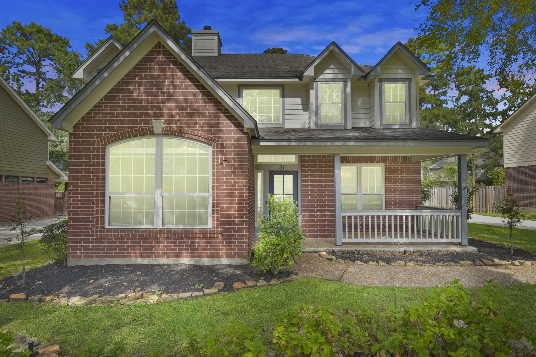 a front view of a house with garden