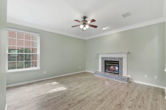 wooden floor in an empty room with a window
