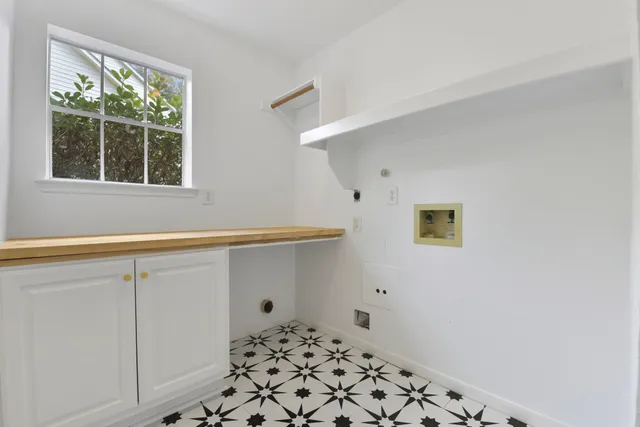 a kitchen with a sink and refrigerator