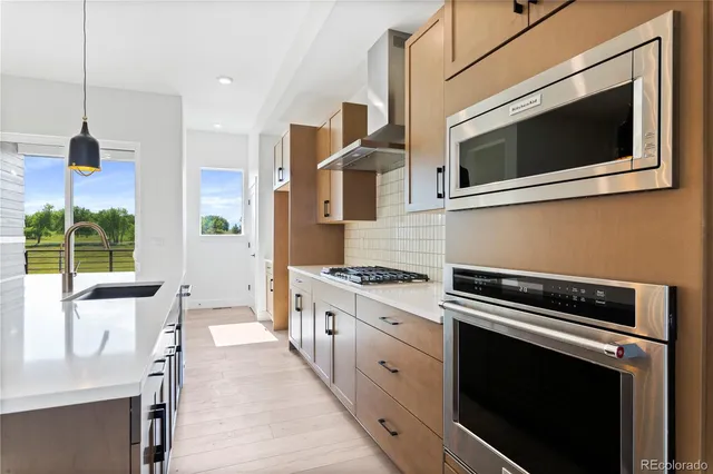 a kitchen with a stove and a microwave