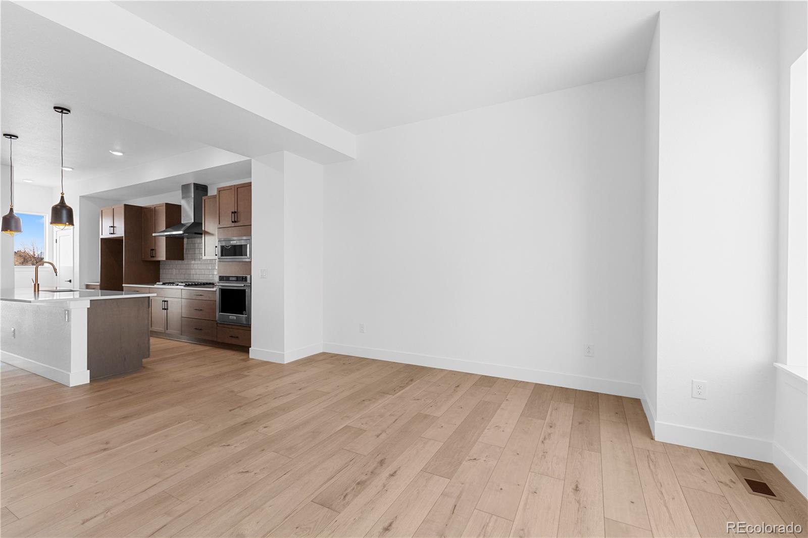 14241 Currant Street Broomfield, CO 80020 - Photo 19 of 25 a view of kitchen with wooden floor