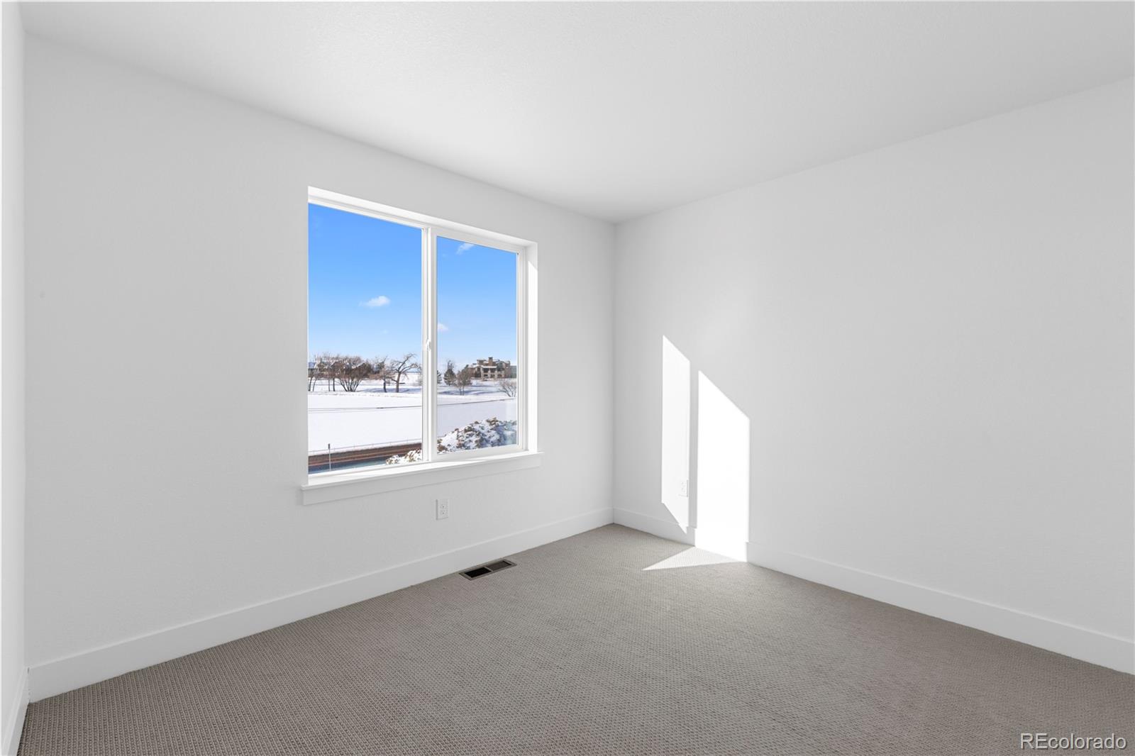 14241 Currant Street Broomfield, CO 80020 - Photo 24 of 25 an empty room with a window