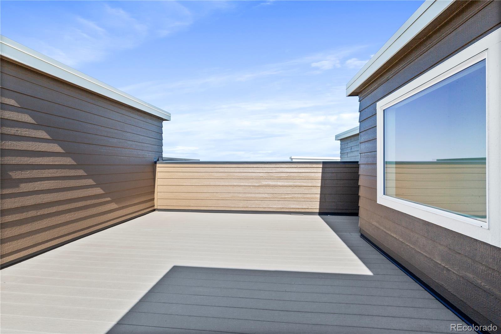 14241 Currant Street Broomfield, CO 80020 - Photo 5 of 25 a view of a terrace with sky view
