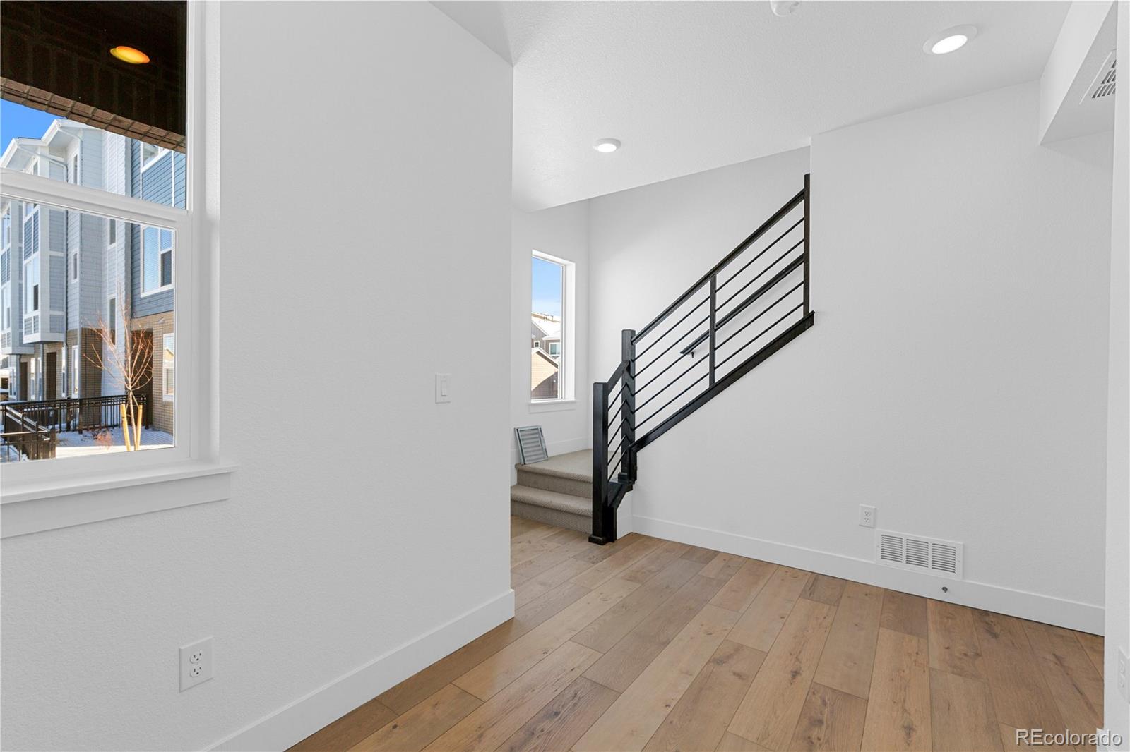 14241 Currant Street Broomfield, CO 80020 - Photo 8 of 25 a view of entryway with wooden floor