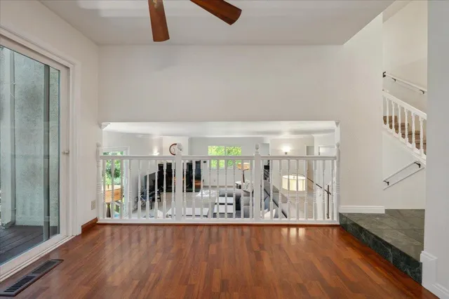 a view of a living room and hardwood floor