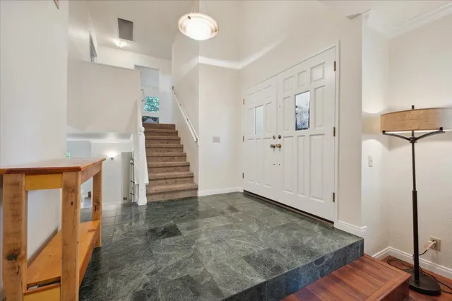 a view of a hallway with staircase