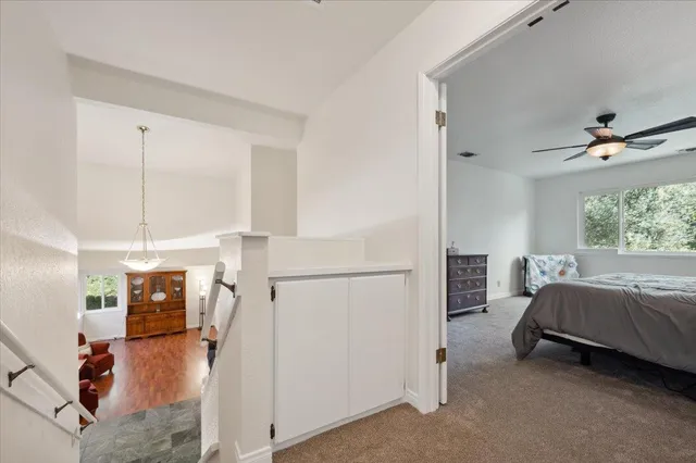 a spacious bedroom with a bed and a window