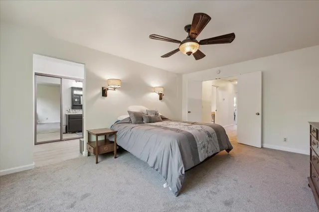 a bathroom with a tub shower and sink