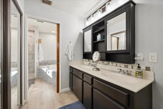 a bathroom with a bathtub and a toilet