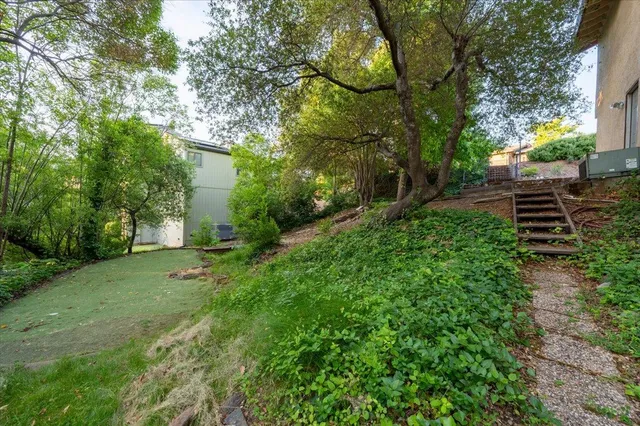 a view of balcony with wooden floor and outdoor seating
