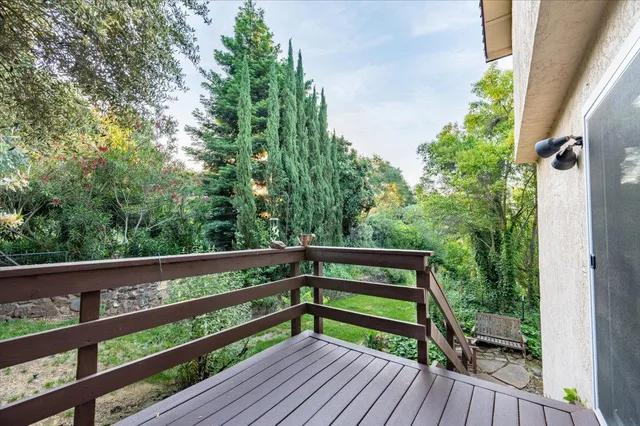 an aerial view of a house with lots of trees