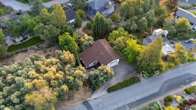 an aerial view of house with yard