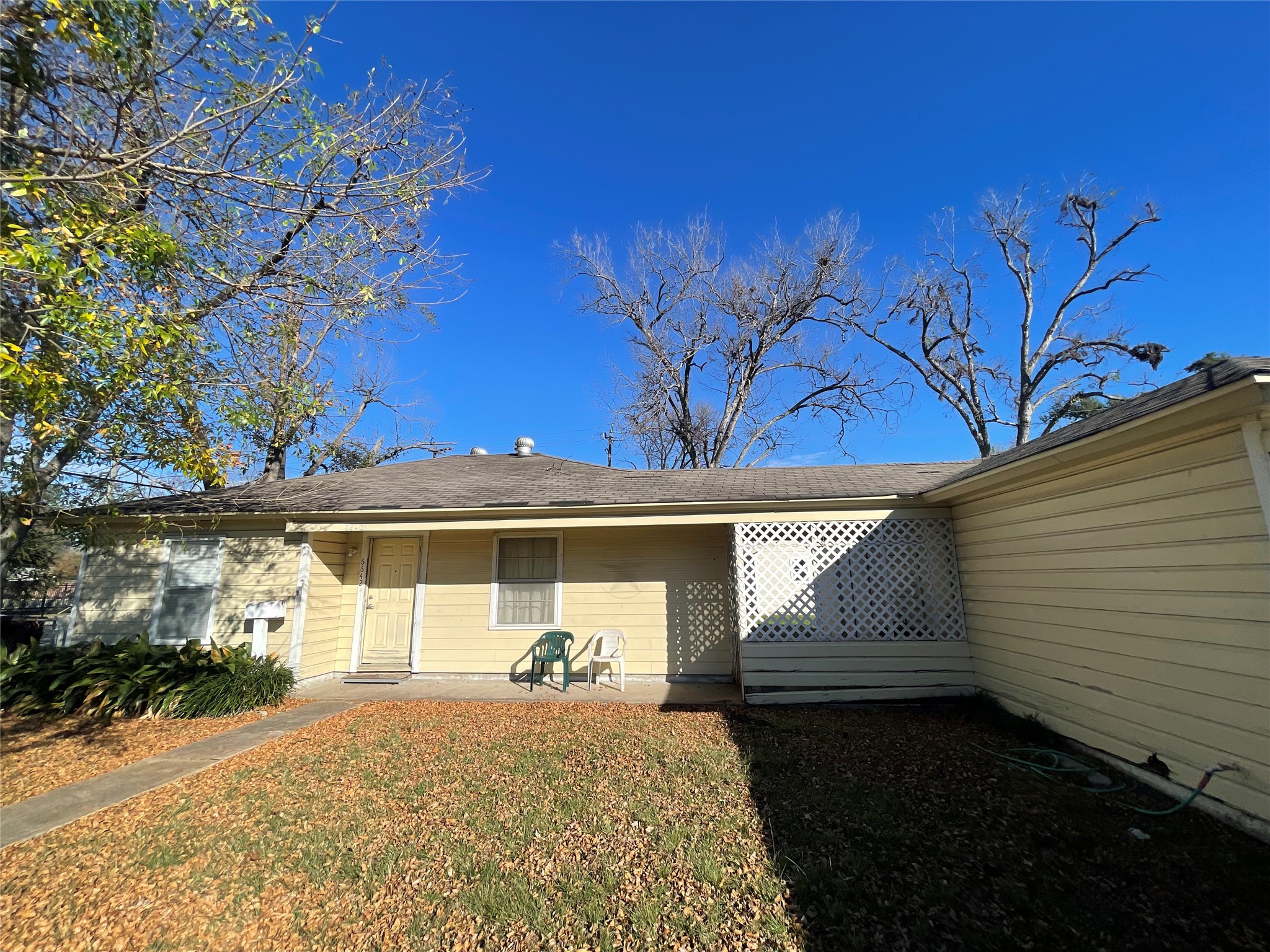 6642 Teluco Street Houston, TX 77055 - Photo 1 of 27 a front view of a house with garden
