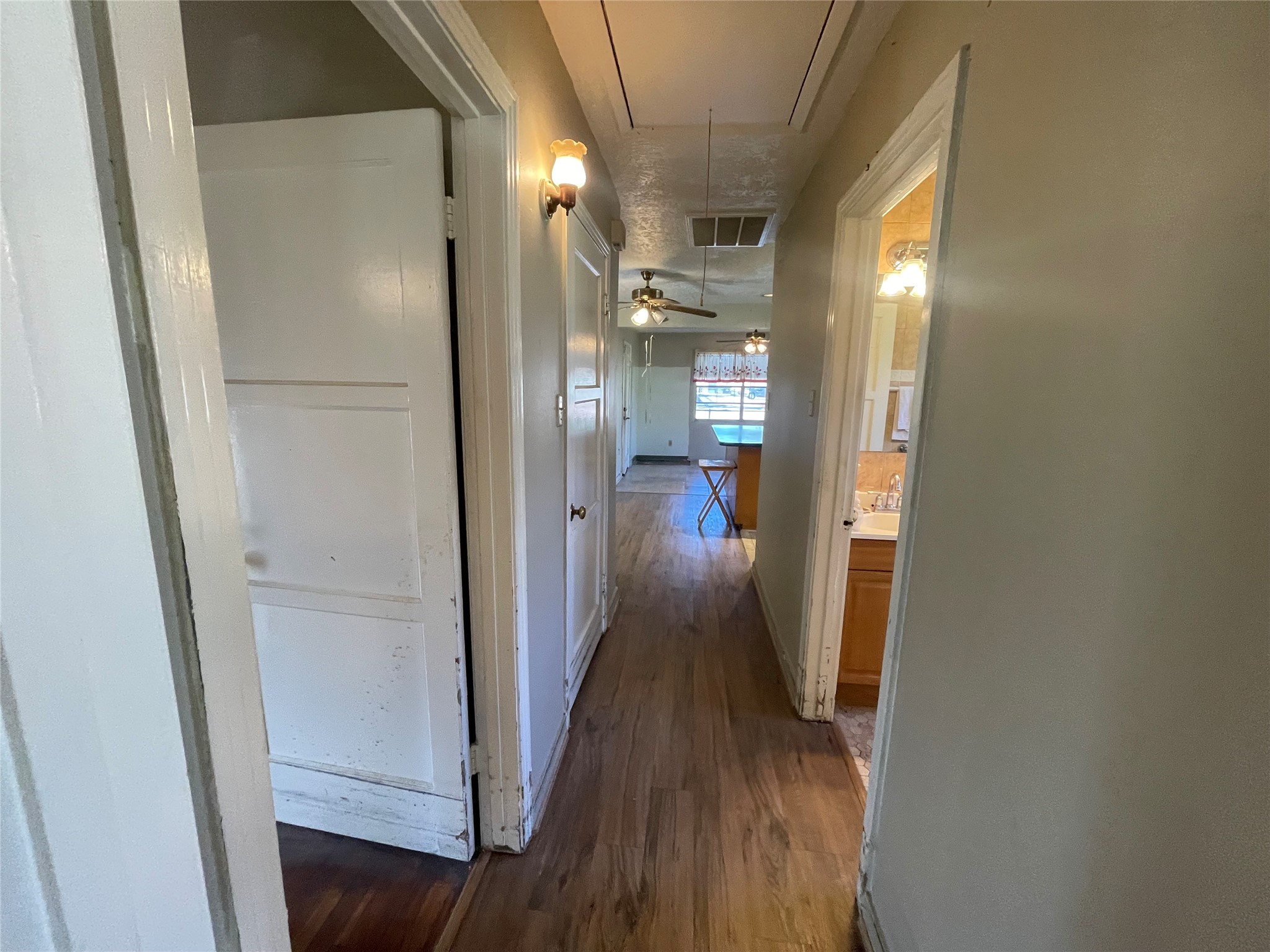 6642 Teluco Street Houston, TX 77055 - Photo 16 of 27 a view of a hallway with wooden floor