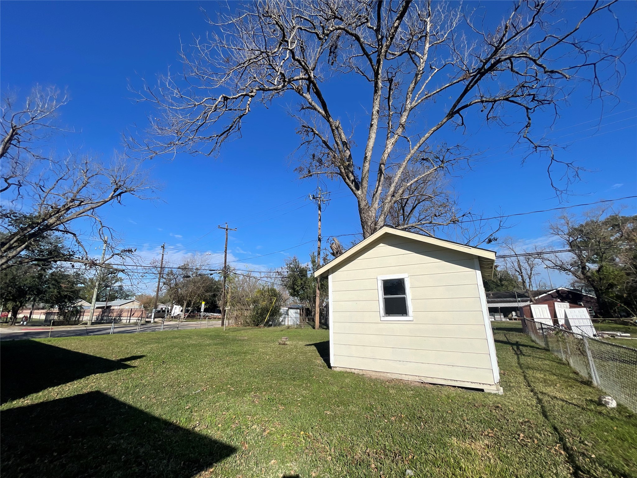6642 Teluco Street Houston, TX 77055 - Photo 18 of 27 a view of a house with a yard