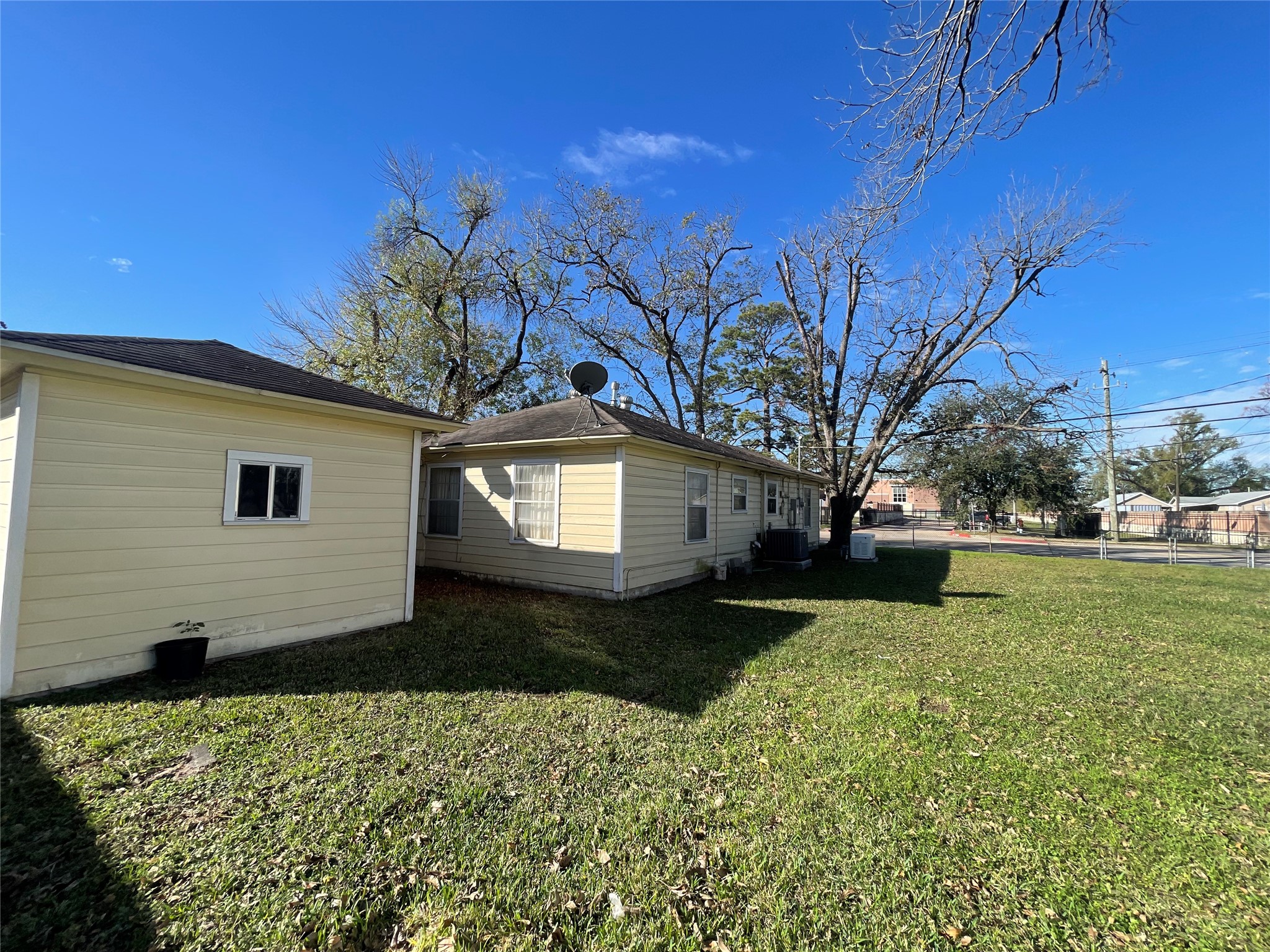 6642 Teluco Street Houston, TX 77055 - Photo 19 of 27 a front view of a house with a yard