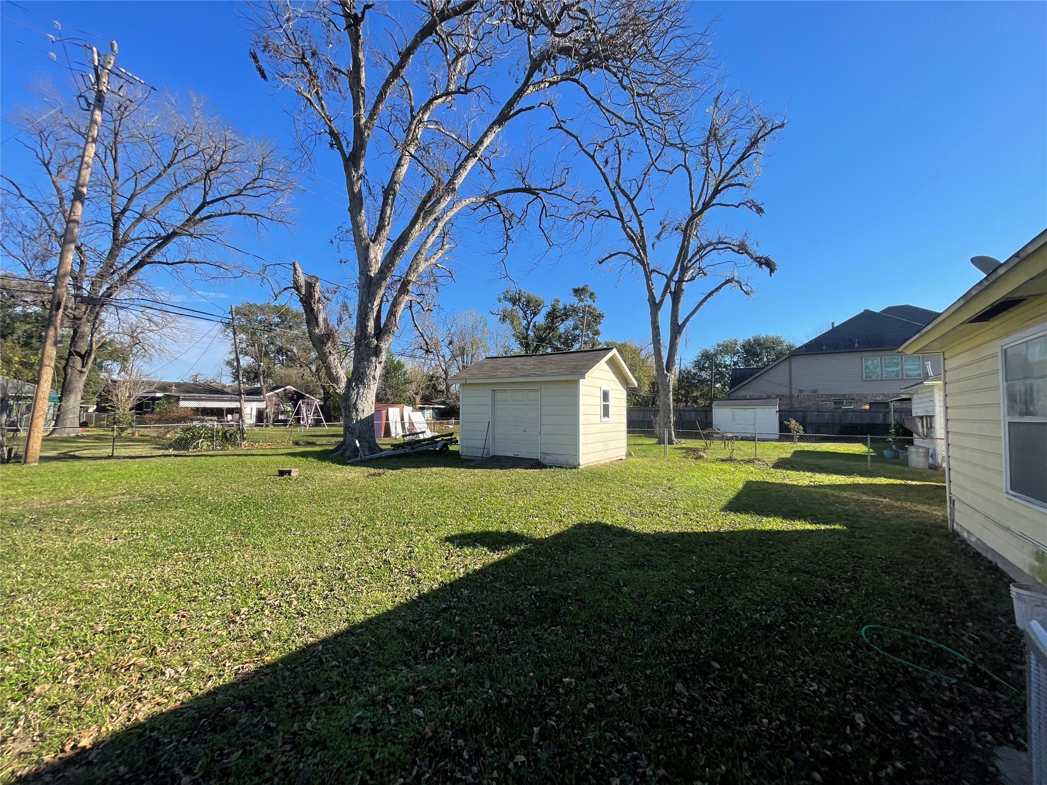 6642 Teluco Street Houston, TX 77055 - Photo 20 of 27 a view of a house with a yard