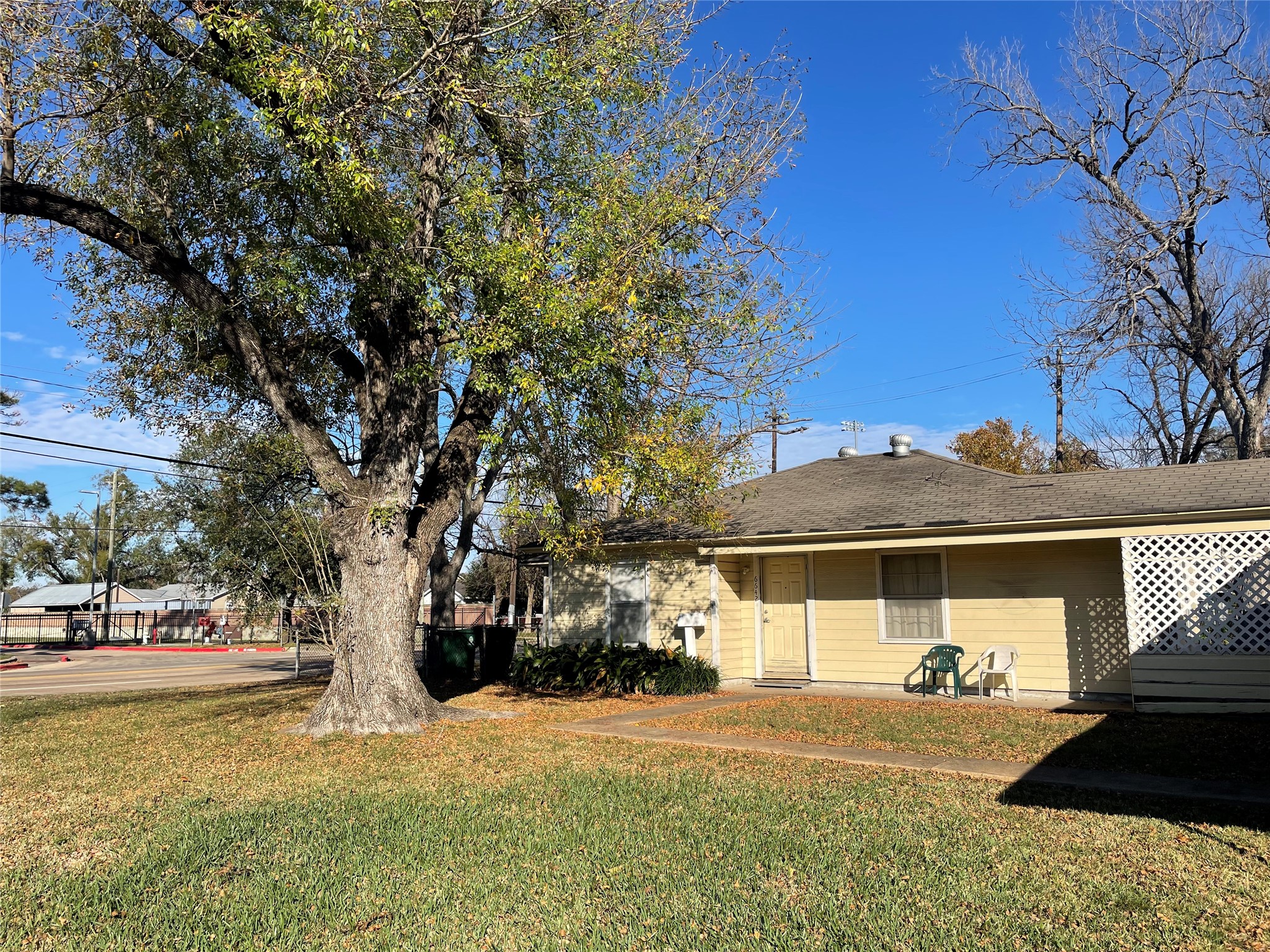 6642 Teluco Street Houston, TX 77055 - Photo 21 of 27 a view of a house with a yard