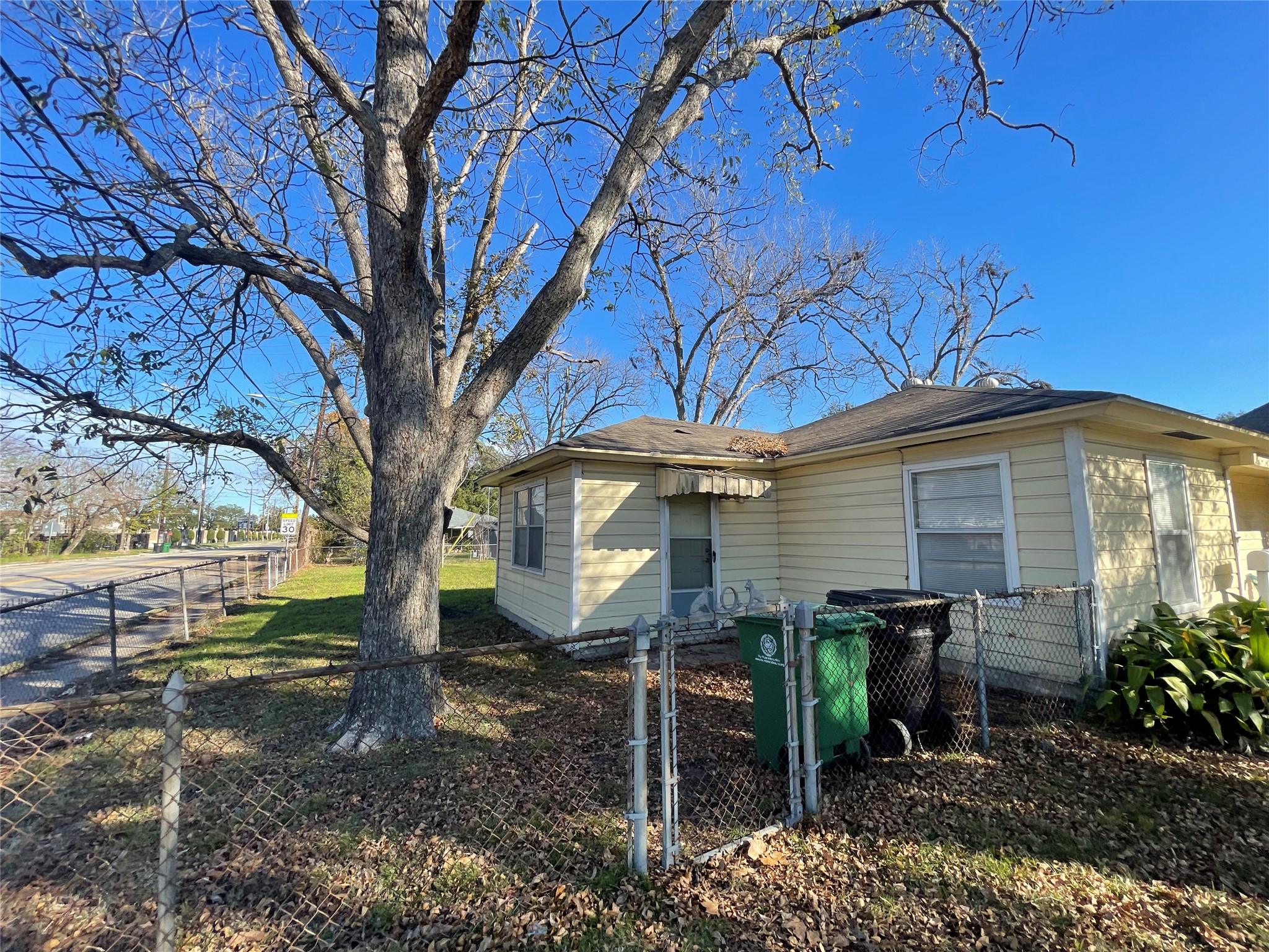 6642 Teluco Street Houston, TX 77055 - Photo 23 of 27 a view of a house with a yard