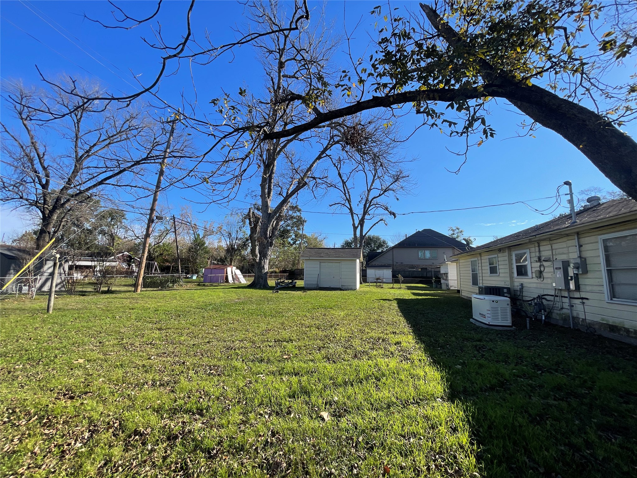 6642 Teluco Street Houston, TX 77055 - Photo 25 of 27 a backyard of a house with lots of green space