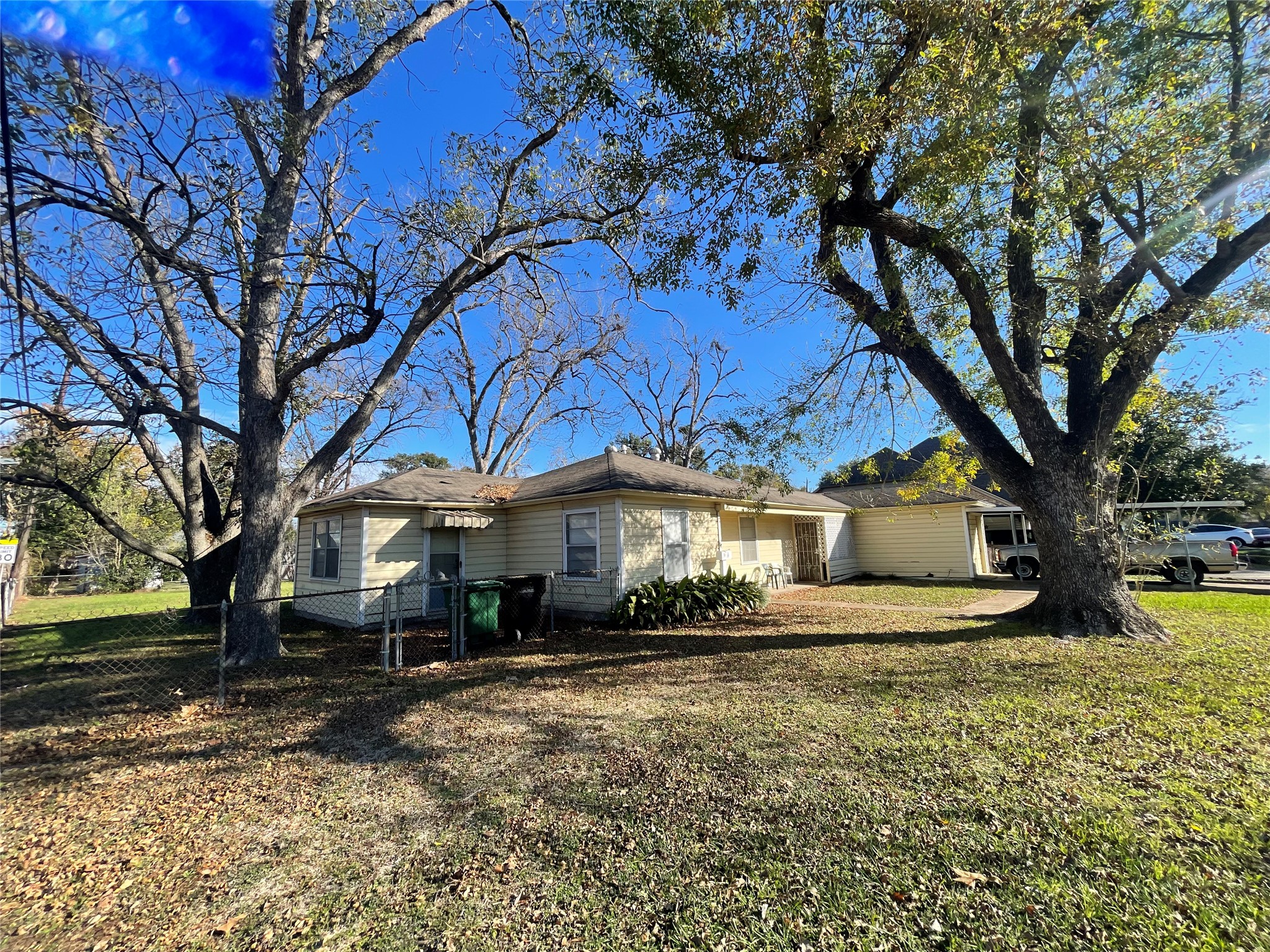 6642 Teluco Street Houston, TX 77055 - Photo 26 of 27 a front view of a house with a yard