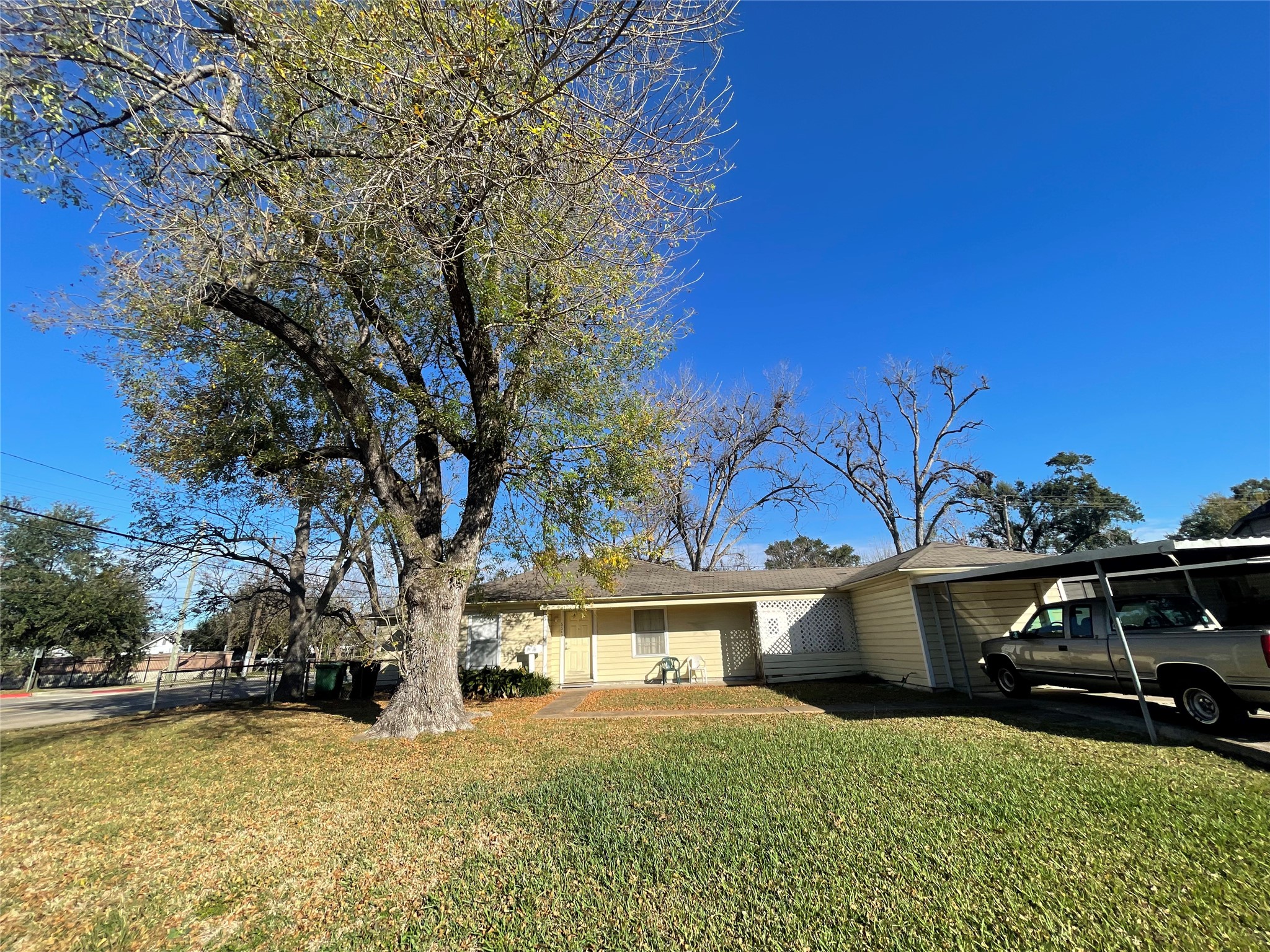 6642 Teluco Street Houston, TX 77055 - Photo 27 of 27 a view of a house with a yard