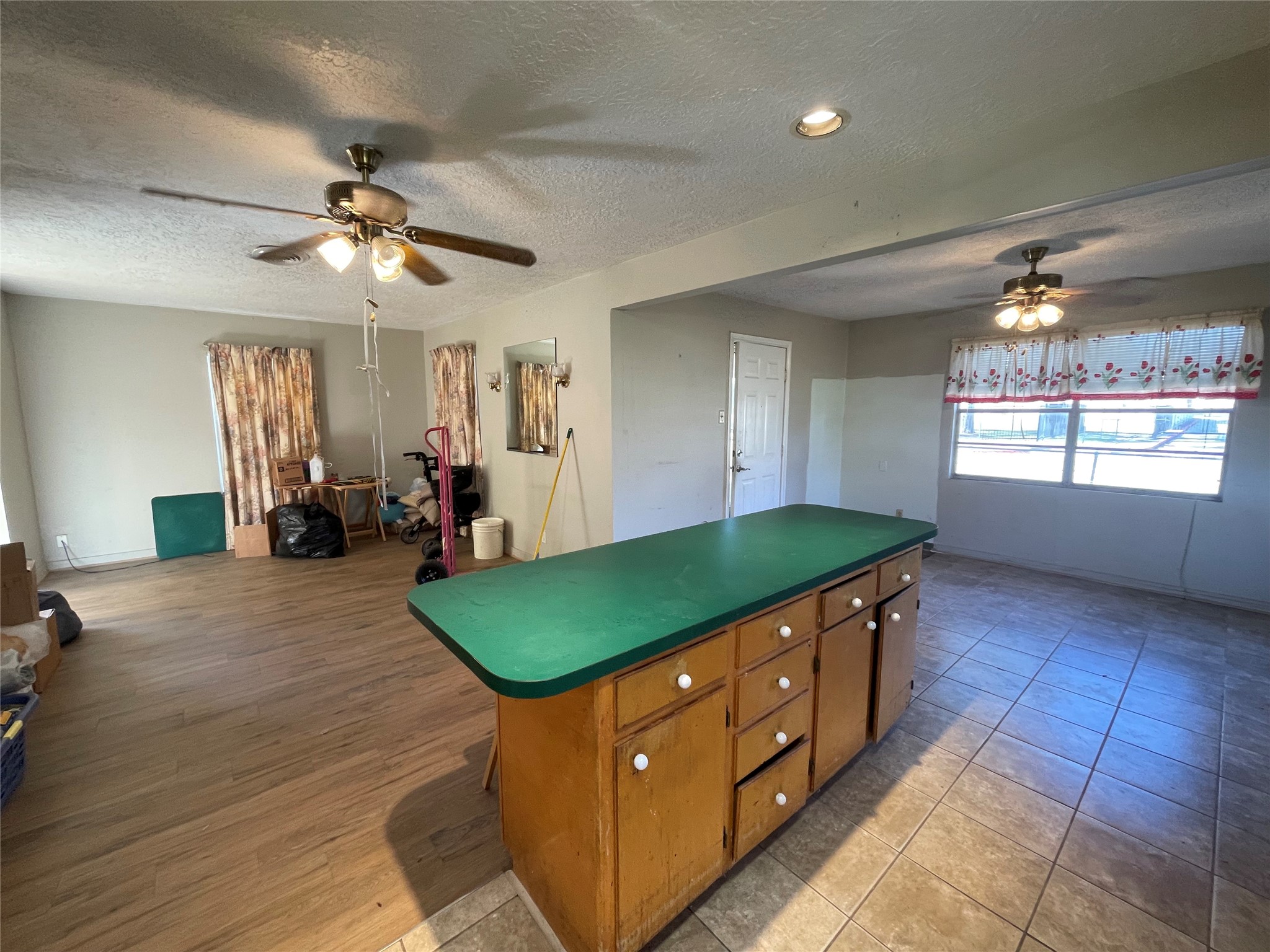 6642 Teluco Street Houston, TX 77055 - Photo 6 of 27 a room with lots of wooden furniture and windows
