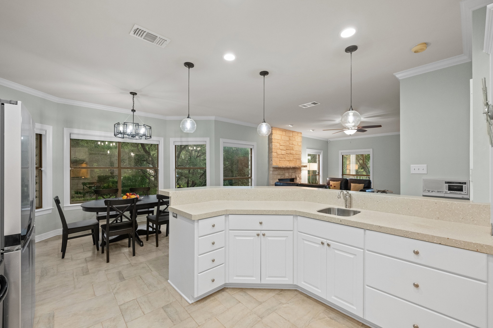6004 Mt Bonnell Road Austin, TX 78731 - Photo 13 of 24 a view of a kitchen center island and windows