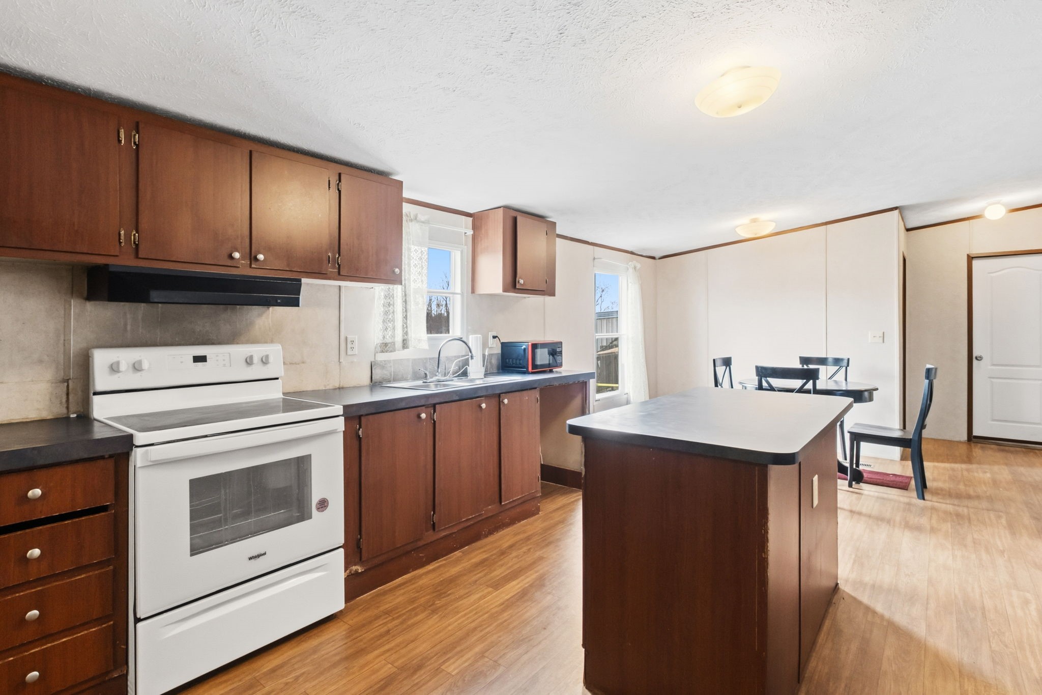 3412 Huffman-Eastgate Road Huffman, TX 77336 - Photo 23 of 43 a kitchen with cabinets a sink and appliances