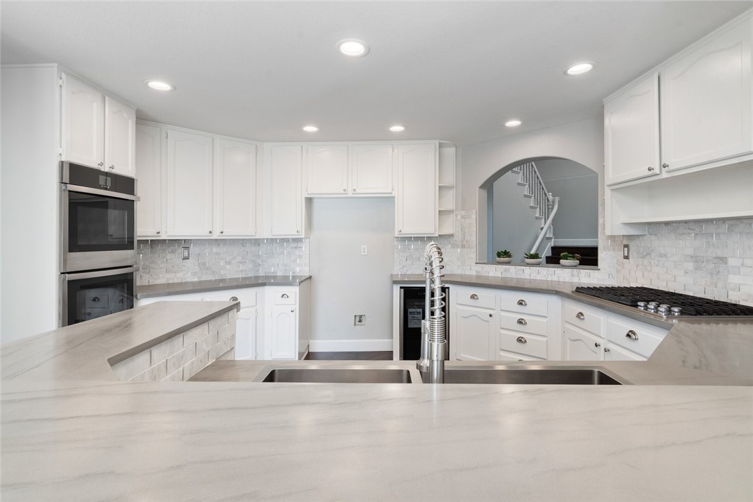 31895 Dane Court Temecula, CA 92591 - Photo 11 of 48 a kitchen with stainless steel appliances granite countertop a stove a sink and a refrigerator