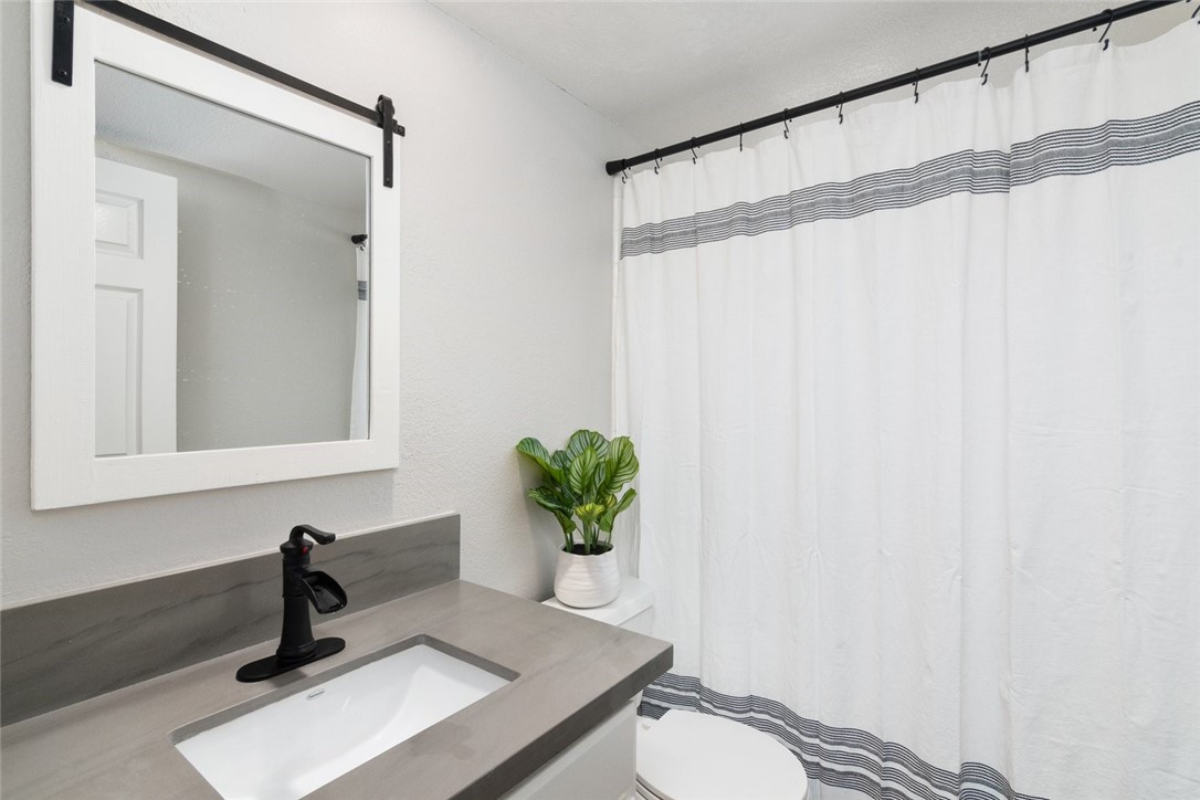 31895 Dane Court Temecula, CA 92591 - Photo 21 of 48 a bathroom with a sink and a mirror